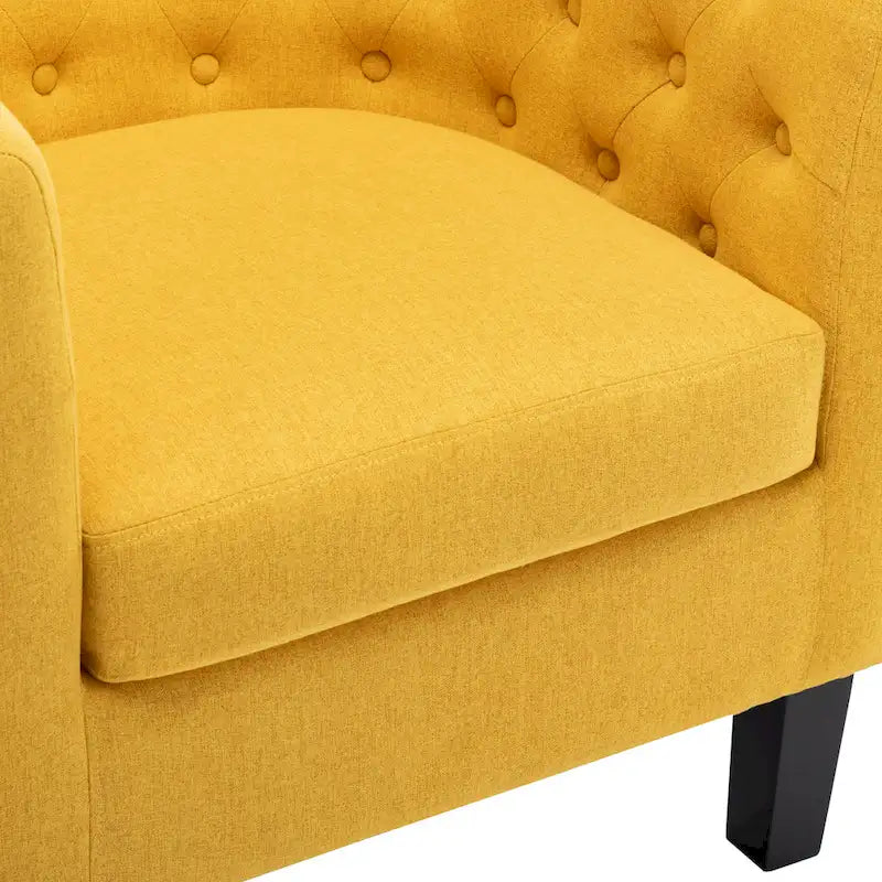 Fauteuil club capitonné en tissu