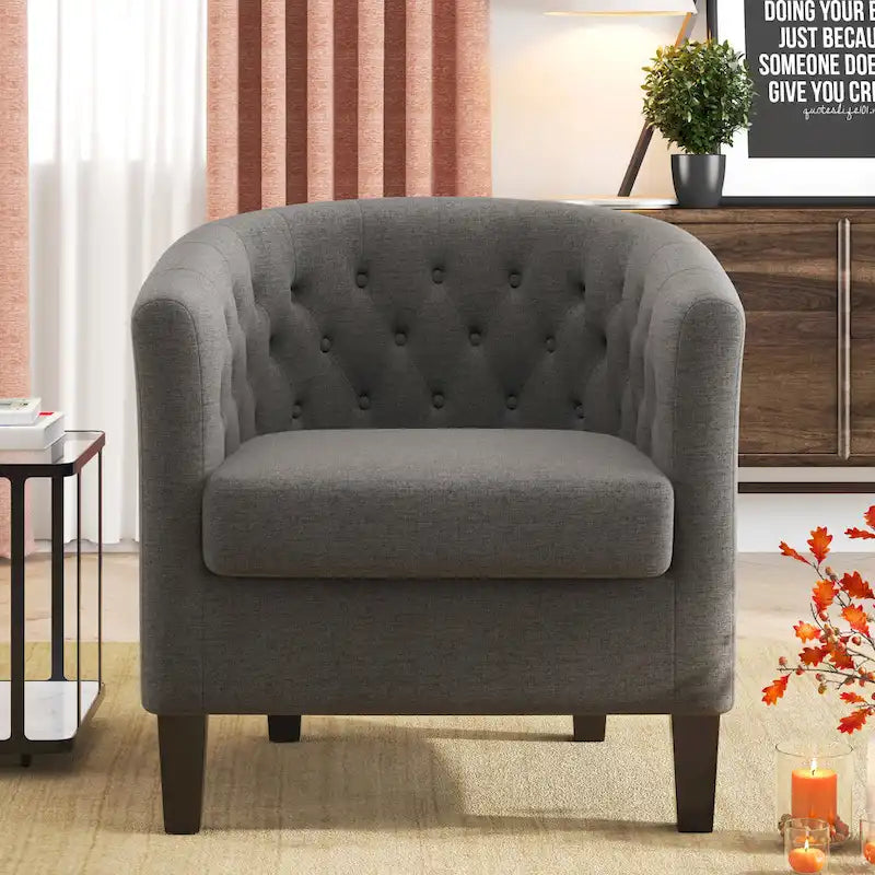 Fauteuil club capitonné en tissu