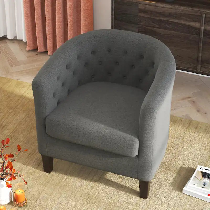 Fauteuil club capitonné en tissu