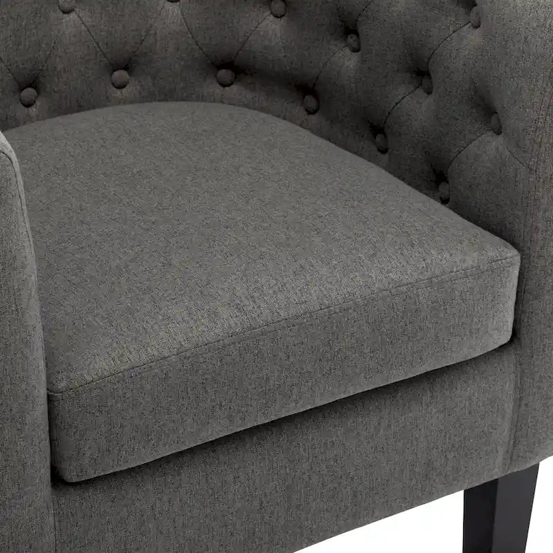 Fauteuil club capitonné en tissu