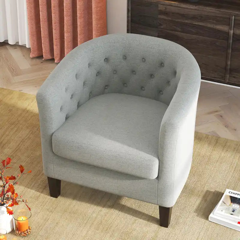 Fauteuil club capitonné en tissu